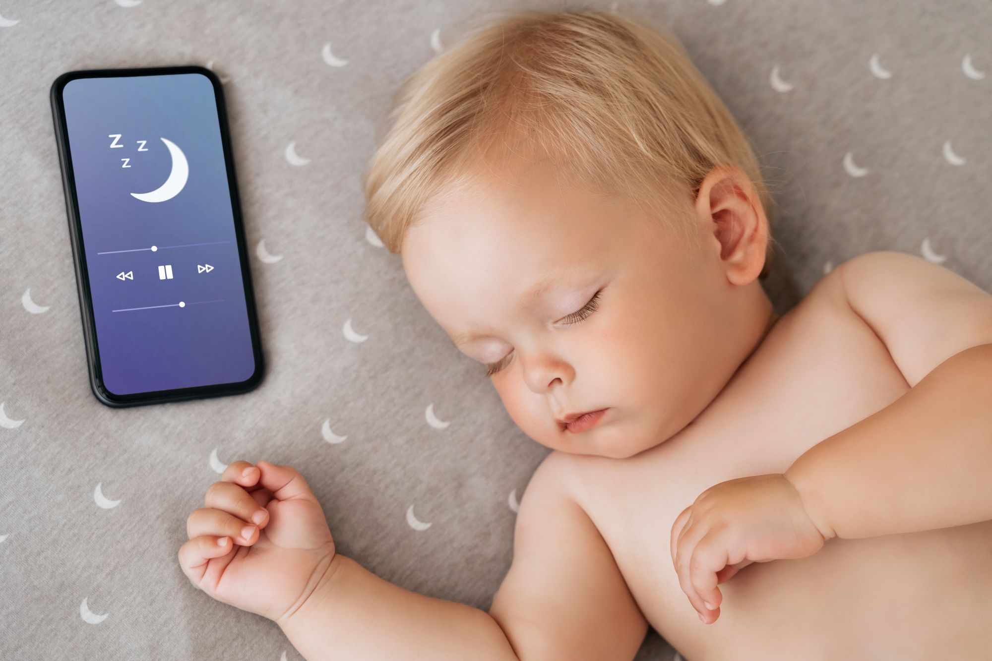 Baby sleeping peacefully while a personalised lullaby plays on the Baby Sleep Music app
